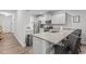Eat-in kitchen with granite countertops and bar stool seating, perfect for casual dining at 124 Boomer St, Benson, NC 27504