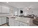 Spacious kitchen with a central island overlooking the living room and fireplace at 124 Boomer St, Benson, NC 27504