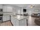 Open-concept kitchen with a large island and seamless flow to the living area at 124 Boomer St, Benson, NC 27504