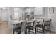 Bright kitchen featuring stainless steel appliances, granite countertops, and barstool seating at 124 Boomer St, Benson, NC 27504