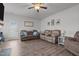 Well-lit living room with hardwood floors, neutral colors, and access to the backyard at 124 Boomer St, Benson, NC 27504