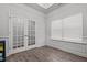 A playroom or flex space with hardwood floors, neutral colors, and access to other rooms at 124 Boomer St, Benson, NC 27504