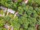 Aerial view of homes surrounded by mature trees at 125 Amesbury Ln, Cary, NC 27511