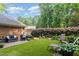 Expansive backyard featuring lush landscaping, ample seating, and a well-manicured lawn at 125 Amesbury Ln, Cary, NC 27511
