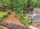 Aerial view of a backyard featuring a patio, lush landscaping, and privacy at 125 Amesbury Ln, Cary, NC 27511