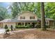 Inviting two-story home with a welcoming front porch and lush landscaping at 125 Amesbury Ln, Cary, NC 27511