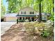 Traditional two-story home with a welcoming porch and well-maintained landscaping at 125 Amesbury Ln, Cary, NC 27511
