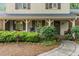 Inviting front porch with seating, manicured landscaping, and a welcoming entrance at 125 Amesbury Ln, Cary, NC 27511