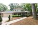 Charming two-story home with manicured landscaping and a welcoming walkway at 125 Amesbury Ln, Cary, NC 27511