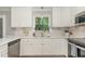 Bright and airy kitchen with stainless steel appliances and ample counter space at 125 Amesbury Ln, Cary, NC 27511