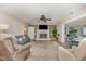 Comfortable living room featuring a fireplace, neutral walls, and hardwood floors at 125 Amesbury Ln, Cary, NC 27511