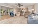 Bright living room with open layout, hardwood floors, and access to sunroom and kitchen at 125 Amesbury Ln, Cary, NC 27511