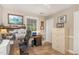 Home office features a rustic desk, filing cabinet, and wood-look flooring at 125 Amesbury Ln, Cary, NC 27511