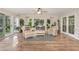 Bright sunroom with lots of plants and natural light, featuring wicker furniture at 125 Amesbury Ln, Cary, NC 27511