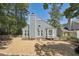 Exterior of home featuring a rock garden, manicured landscaping, and charming architectural details at 1304 Greenside Dr, Raleigh, NC 27609