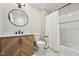 Updated bathroom with vanity, shower with tub, and modern finishes at 1304 Greenside Dr, Raleigh, NC 27609