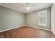 Neutral bedroom with ceiling fan, closet, and natural light from one window at 1304 Greenside Dr, Raleigh, NC 27609