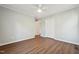 Neutral bedroom with closet, ceiling fan, and view to open doorway at 1304 Greenside Dr, Raleigh, NC 27609