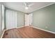 Bedroom with ceiling fan, closet and view to open doorway at 1304 Greenside Dr, Raleigh, NC 27609