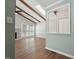 Living room with beamed ceilings, fireplace, and wood floors at 1304 Greenside Dr, Raleigh, NC 27609