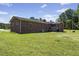 Brick house sits on a well-maintained lawn in the backyard at 137 Vaiden Rd, Louisburg, NC 27549