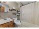 Traditional bathroom with a shower-tub combo and functional wall mounted organizers at 137 Vaiden Rd, Louisburg, NC 27549