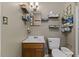 Functional bathroom featuring a sink, toilet, and wall-mounted organizers at 137 Vaiden Rd, Louisburg, NC 27549