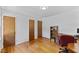 This is a spacious bedroom with hardwood floors and a desk with shelving at 137 Vaiden Rd, Louisburg, NC 27549