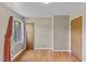 Bright bedroom with neutral walls, natural lighting, and hardwood floors at 137 Vaiden Rd, Louisburg, NC 27549