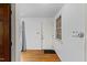 Entryway featuring hardwood floors, a white door, and a window, creating a welcoming ambiance at 137 Vaiden Rd, Louisburg, NC 27549