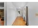 Bright entryway with hardwood floors, white walls, and a glass-paneled door, offering natural light at 137 Vaiden Rd, Louisburg, NC 27549