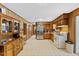 Spacious kitchen with wood cabinets and stainless steel refrigerator at 137 Vaiden Rd, Louisburg, NC 27549