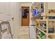 Room with cleaning supplies, a step ladder, and shelving at 137 Vaiden Rd, Louisburg, NC 27549