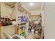 Ample storage solutions in this room, including shelving units, containers, and a functional washer at 137 Vaiden Rd, Louisburg, NC 27549