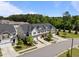 A beautiful neighborhood featuring townhomes, manicured lawns, and tree-lined streets at 1394 Southpoint Trl, Durham, NC 27713