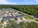 An aerial view of newly constructed townhomes with manicured lawns in a peaceful, wooded community at 1394 Southpoint Trl, Durham, NC 27713
