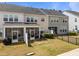 Townhome backyards with screened patios and fenced lawns, perfect for relaxing and enjoying the outdoors at 1394 Southpoint Trl, Durham, NC 27713