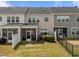 Townhome backyards with screened patios, privacy fences, and well-maintained lawns, perfect for outdoor relaxation at 1394 Southpoint Trl, Durham, NC 27713