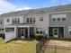 Townhome backyards with screened patios and fenced yards, offering cozy and private outdoor living spaces at 1394 Southpoint Trl, Durham, NC 27713