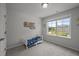 Bright bedroom with a large window, a toddler bed, and a charming 'Clark Thomas' wall decoration at 1394 Southpoint Trl, Durham, NC 27713