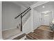 Welcoming entryway with staircase, modern flooring, and ample natural light creates a warm first impression at 1394 Southpoint Trl, Durham, NC 27713