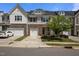 Inviting townhome with a single-car garage, stone accents, and a nicely landscaped front yard at 1394 Southpoint Trl, Durham, NC 27713
