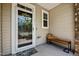 Cozy front porch with a decorative wreath on the door and a bench with a colorful pillow at 1394 Southpoint Trl, Durham, NC 27713
