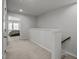 Upstairs hallway with carpet floors and an open view to the main bedroom provide access to all rooms at 1394 Southpoint Trl, Durham, NC 27713