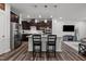 Modern kitchen with stainless steel appliances, a breakfast bar, and stylish pendant lighting at 1394 Southpoint Trl, Durham, NC 27713