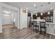 Open-concept kitchen featuring a breakfast bar with seating, stainless steel appliances, and modern finishes at 1394 Southpoint Trl, Durham, NC 27713