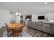 Open-concept living space showcasing a kitchen, dining area, and comfortable seating, perfect for modern living at 1394 Southpoint Trl, Durham, NC 27713
