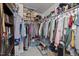 Organized walk-in closet featuring clothing racks, shelving, and ample storage space for shoes and accessories at 1394 Southpoint Trl, Durham, NC 27713