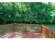 A cozy wooden deck provides a seamless transition to the outdoors, perfect for enjoying nature at 1443 Smokey Mountain Dr, Zebulon, NC 27597