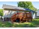 The back of the house features a wooden deck ideal for outdoor enjoyment in the backyard at 1443 Smokey Mountain Dr, Zebulon, NC 27597